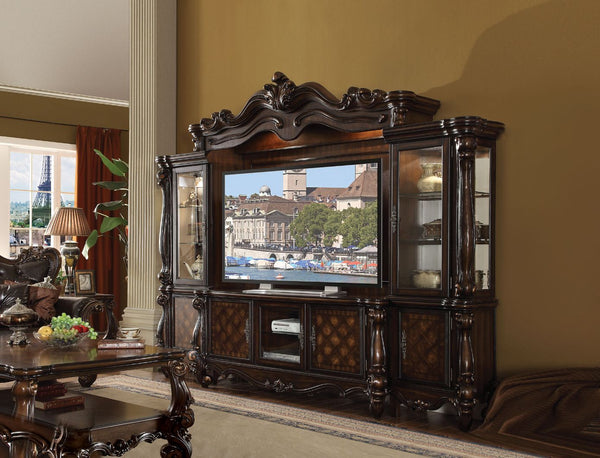 The Versailles the entertainment center was inspired by old European design. This collection features carved scrollwork accent on the bridge-'s crown. The collection pieces are carefully crafted with selected wood and veneers in Cherry Oak finish with han