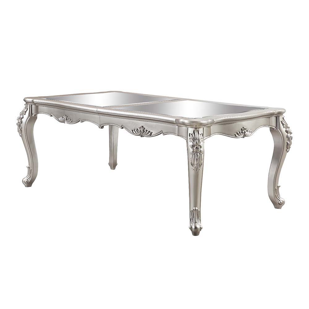 An ode to traditional glamour, the Devayne dining table brings in all the allure and charm that you are seeking for a dining table. The table features an extension leaf that allows for additional dinner guests. The champagne finish enhances the beautiful 