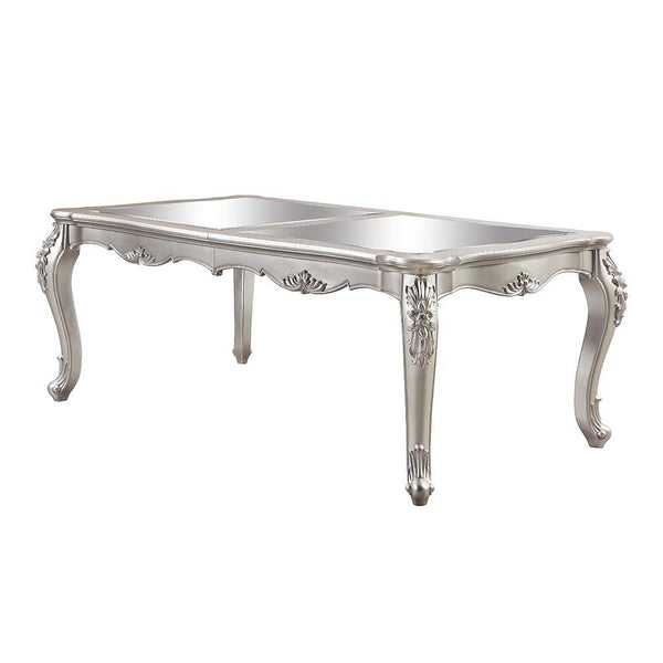 An ode to traditional glamour, the Devayne dining table brings in all the allure and charm that you are seeking for a dining table. The table features an extension leaf that allows for additional dinner guests. The champagne finish enhances the beautiful 