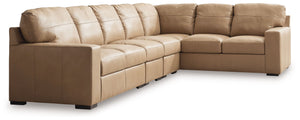 Indulge in attainable, top-of-the-line luxury. With this sectional, you can outfit your home in ultra-sleek style. Genuine leather upholstery on the interior provides the richly refined look and feel you love without breaking the bank. Clean-lined arms po