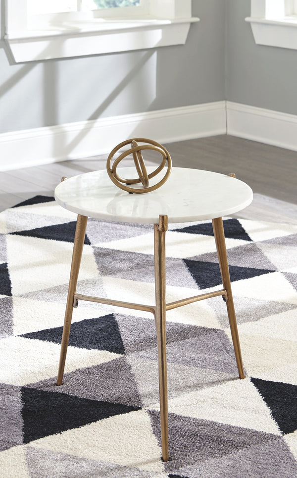  contemporary style with this accent table. Its round white marble top is paired with an antiqued goldtone tripod base. The result: an ultra-rich aesthetic priced to entice.<br/><br/><b>Product Features</b><ul><li>White marble tabl