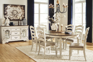 Traditional cottage design. Antiqued two-tone finish featuring chipped white with distressed wood finished tops. Tops feature Oak veneers, while the cases are made with birch veneers and hardwood solids. Framed drawer fronts and decorative fret laid over 