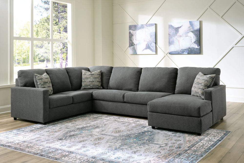 Contemporary fashion, meet superior form. This sectional with chaise is strikingly streamlined with its track arms. Cozy cushions invite superior relaxation, while handsome charcoal upholstery speaks to tried-and-true modern color palettes. Simply kick ba
