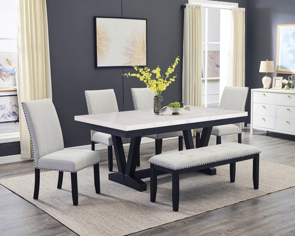A fresh take on a traditional silhouette makes this group a great addition to your dining space. A genuine marble top is luxurious and timeless. The trestle base is updated in a contemporary charcoal finish. The upholstered dining chairs feature gently sl