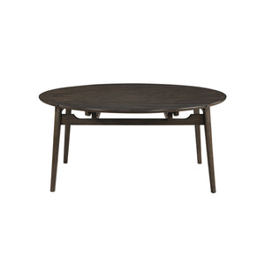 The Rex Mid-Century Modern 65" Round Dining Table with Self-Storing Leaves in Walnut Brown is a versatile and stylish addition to any dining space. Crafted from solid rubberwood, manufactured woods, and oak veneers, this table ensures exceptional stabilit