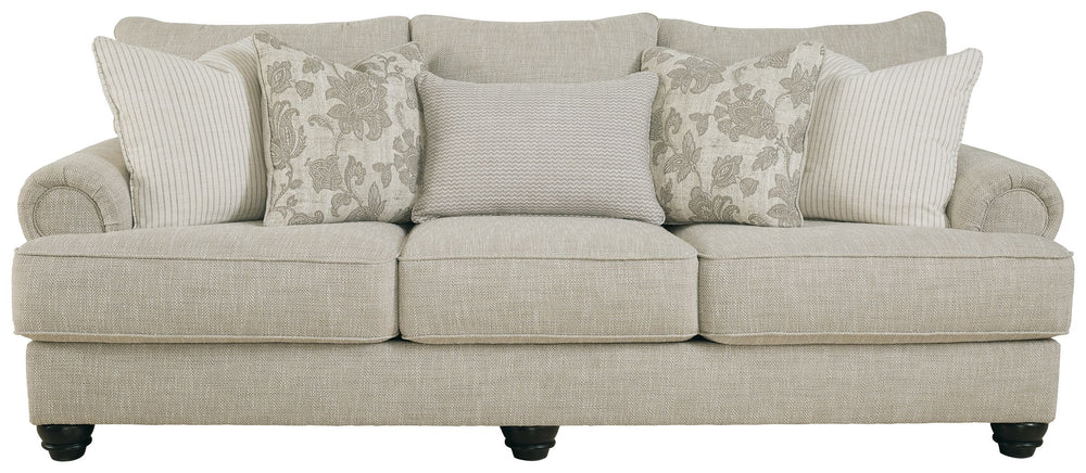 This sofa has an alluring look that-'s guaranteed to turn heads. Richly textured fabric in a light, easygoing hue is enhanced by even lighter flax peeking through. Distinctive roll arms add a dab of debonair, while indulgently plush cushions cradle you so