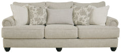 This sofa has an alluring look that-'s guaranteed to turn heads. Richly textured fabric in a light, easygoing hue is enhanced by even lighter flax peeking through. Distinctive roll arms add a dab of debonair, while indulgently plush cushions cradle you so