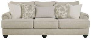 This sofa has an alluring look that-'s guaranteed to turn heads. Richly textured fabric in a light, easygoing hue is enhanced by even lighter flax peeking through. Distinctive roll arms add a dab of debonair, while indulgently plush cushions cradle you so