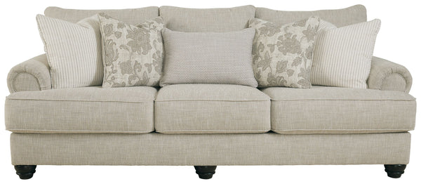 This sofa has an alluring look that-'s guaranteed to turn heads. Richly textured fabric in a light, easygoing hue is enhanced by even lighter flax peeking through. Distinctive roll arms add a dab of debonair, while indulgently plush cushions cradle you so