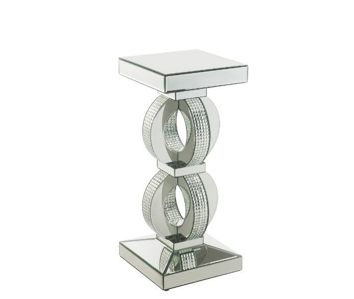 Make a striking statement in your home with this Ornat Accent Table. Featuring mirrored frame with faux diamond inlay, it creates a bold, yet elegant textured look. Classic pedestal base gives it an elegant support, with spectacular faux diamonds inlay ad