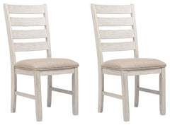 This dining chair invites you to raise the bar for small space living. An inspired choice for coastal chic or modern farmhouse settings, this comfortably cushioned chair sports a grayish white finish with rub through effect for timeworn appeal.<br><br><b>