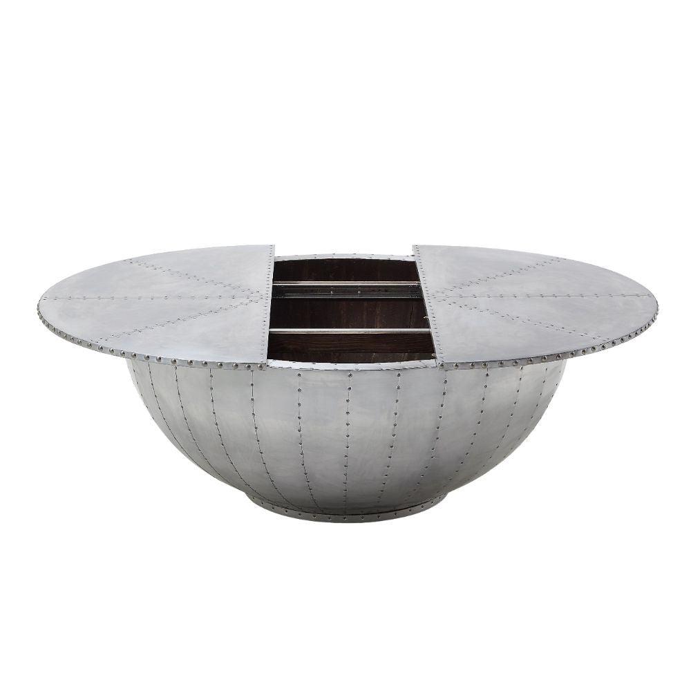 Looking for cutting-edge style? The industrial Brancaster round coffee table is the perfect conversation piece. With features like aluminum patchwork with rich overtones and convenient, discrete storage, this unusual coffee table is sure to impress.<br/><