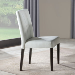The Carena dining set exudes timeless elegance with its white and brown finish. The rectangular dining table features an extension top, perfect for hosting larger gatherings. Paired with stylish side chairs and a matching server, this set combines form an