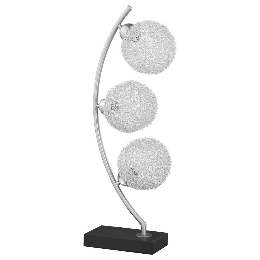 Graceful silhouetting pairs with a trio of elegant wire frame orb shades in a modern table lamp. Designed to make an impact on a console or side table, it features a fresh, modern look complete with a vertical arc frame in a chrome finish. The arc hosts t