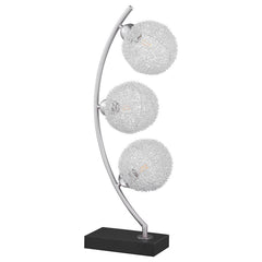 Graceful silhouetting pairs with a trio of elegant wire frame orb shades in a modern table lamp. Designed to make an impact on a console or side table, it features a fresh, modern look complete with a vertical arc frame in a chrome finish. The arc hosts t