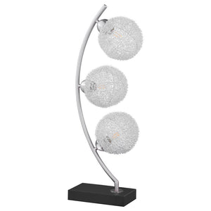 Graceful silhouetting pairs with a trio of elegant wire frame orb shades in a modern table lamp. Designed to make an impact on a console or side table, it features a fresh, modern look complete with a vertical arc frame in a chrome finish. The arc hosts t