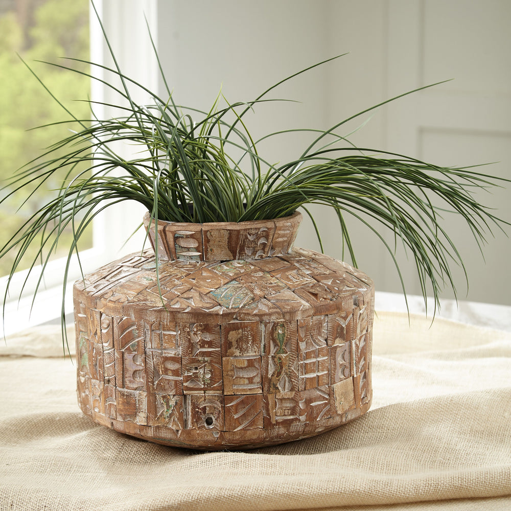 Bring a hint of natural beauty to your decor with this vase. Mesmerizing with its multi-hued finish, the piece-'s reclaimed wood construction has a well-loved look that graces your space with a weathered and warm appeal.<br/><br/><b>Product Features</b><u