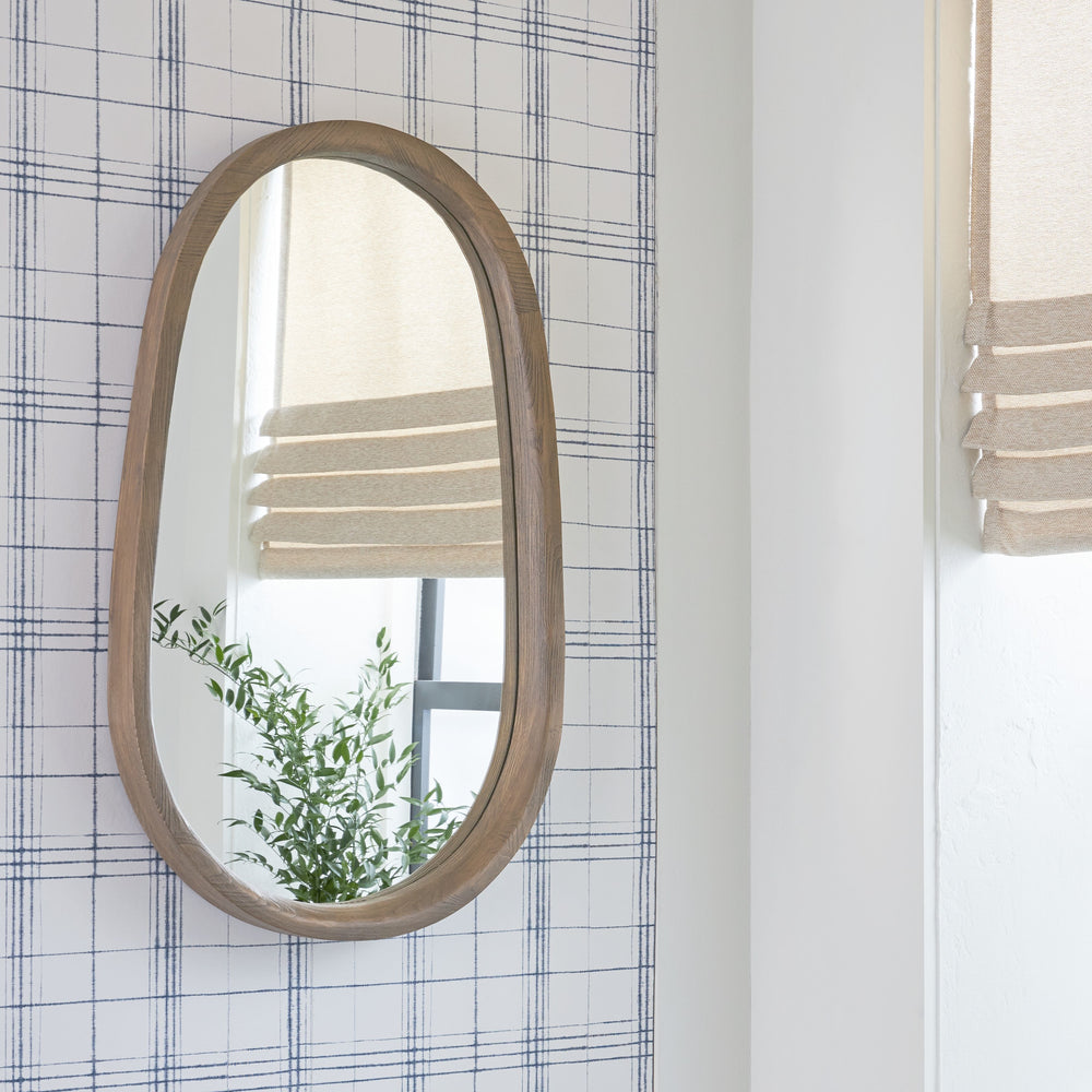This mirror is sure to bring a casual, chic twist to your decor. An antiqued brown wood frame gives it a welcoming, well-worn vibe. Hang it in an entryway or over a console table. Whether this mirror is making a statement all on its own or part of a wall 
