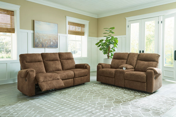 This reclining sofa and matching loveseat is your best shot for comfort and total relaxation. Its super soft faux leather, contemporary bustle back and contrast stitching team up for a big win with most any color scheme and room decor. With the pull tab r