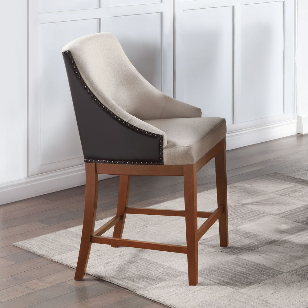 The Gilsea collection counter height table and chairs set combines rustic charm with modern elegance. Featuring a sturdy wooden table and two-tone upholstered chairs, each adorned with nailhead trim, this collection promises a stylish and comfortable dini