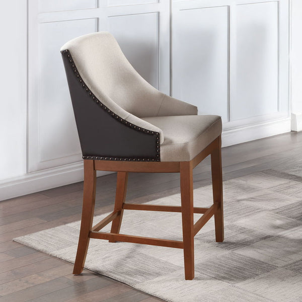 The Gilsea collection counter height table and chairs set combines rustic charm with modern elegance. Featuring a sturdy wooden table and two-tone upholstered chairs, each adorned with nailhead trim, this collection promises a stylish and comfortable dini