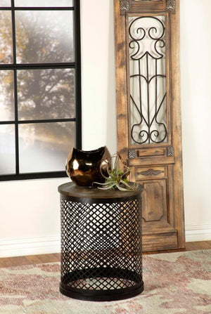  this round accent table makes a striking addition to any space. The solid mango wood top
