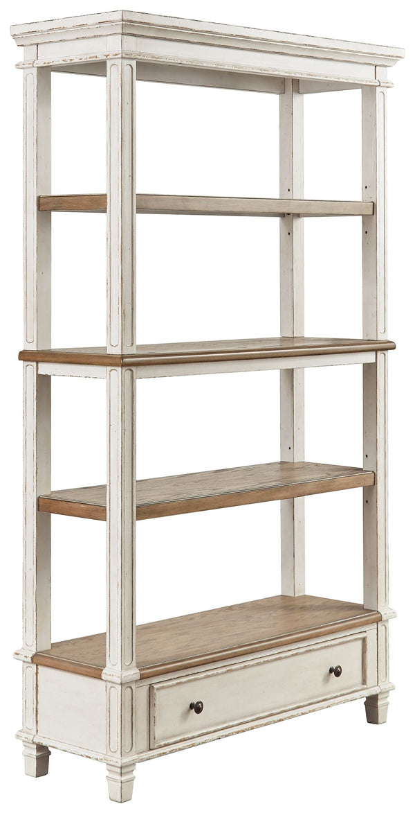 Elevating the art of traditional cottage styling, this bookcase is your heavenly home office realized. Its antiqued two-tone aesthetic blends a chipped white with a distressed wood tone top for added charm. The bookcaseâ€™s clever balance of shelf and dra