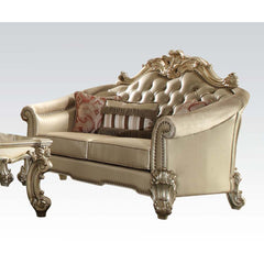 Tracing back to the classical Baroque era, expressed with intent and conviction, our new interpretation of Vendome II is donned. The Vendome II loveseat-'s bone faux leather upholstery is grand and classy with crystal like button tufting on the back in a 