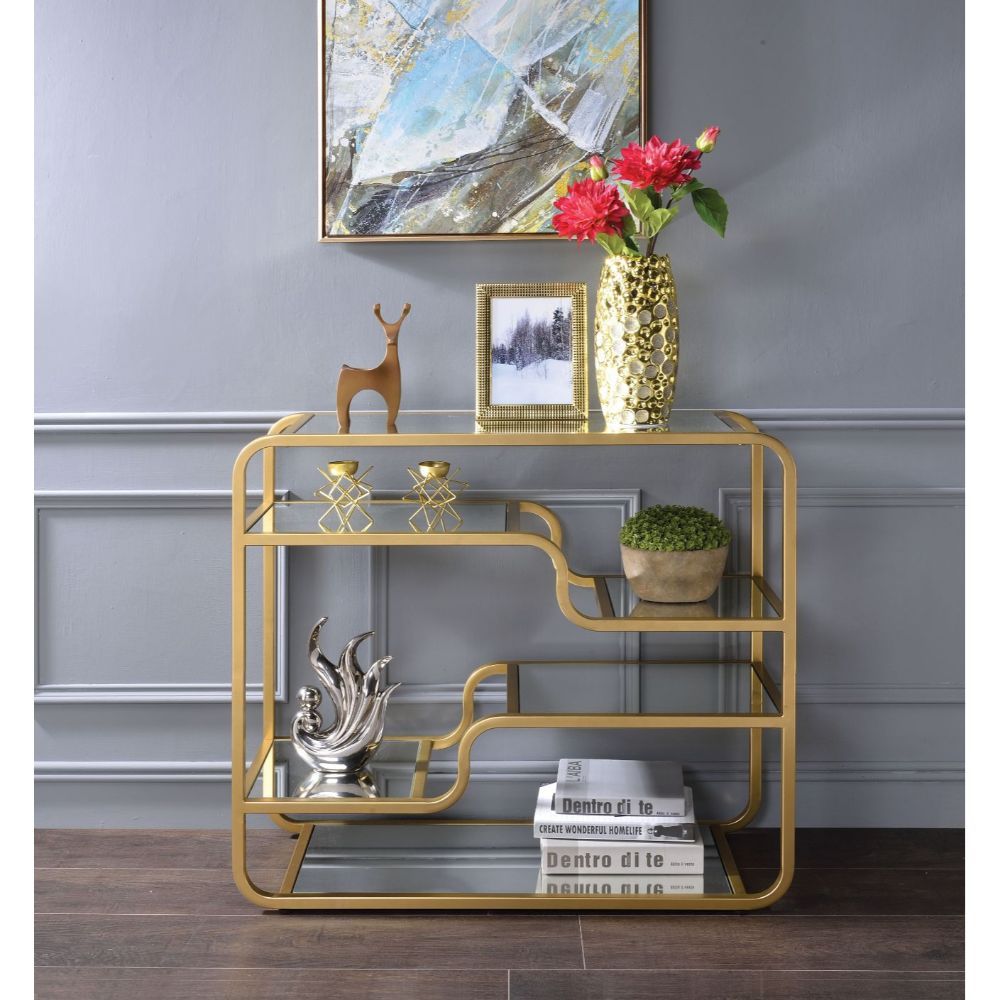 Center your seating arrangement around a sleek and sophisticated style with the Astrid occasional collection. Inspired by timeless materials, it features a mirror top with a stylish curving frame made of refined gold metal coating. A mirrored base and flo