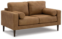 Small-scale style, tailored to perfection. This loveseat echoes retro aesthetics with warm caramel faux leather, while its ultra-linear silhouette incorporates a contemporary edge. Versatile in form and function, the seat suits styles from modern boho to 