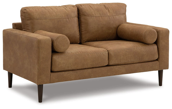 Small-scale style, tailored to perfection. This loveseat echoes retro aesthetics with warm caramel faux leather, while its ultra-linear silhouette incorporates a contemporary edge. Versatile in form and function, the seat suits styles from modern boho to 