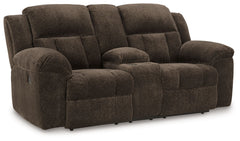 With its large-scale design, this extra-spacious reclining loveseat with console is a masterclass in accessible style. Plush, ultra-soft upholstery keeps everyone cozy as you lounge with family or guests. In a neutral hue, it seamlessly suits different ae