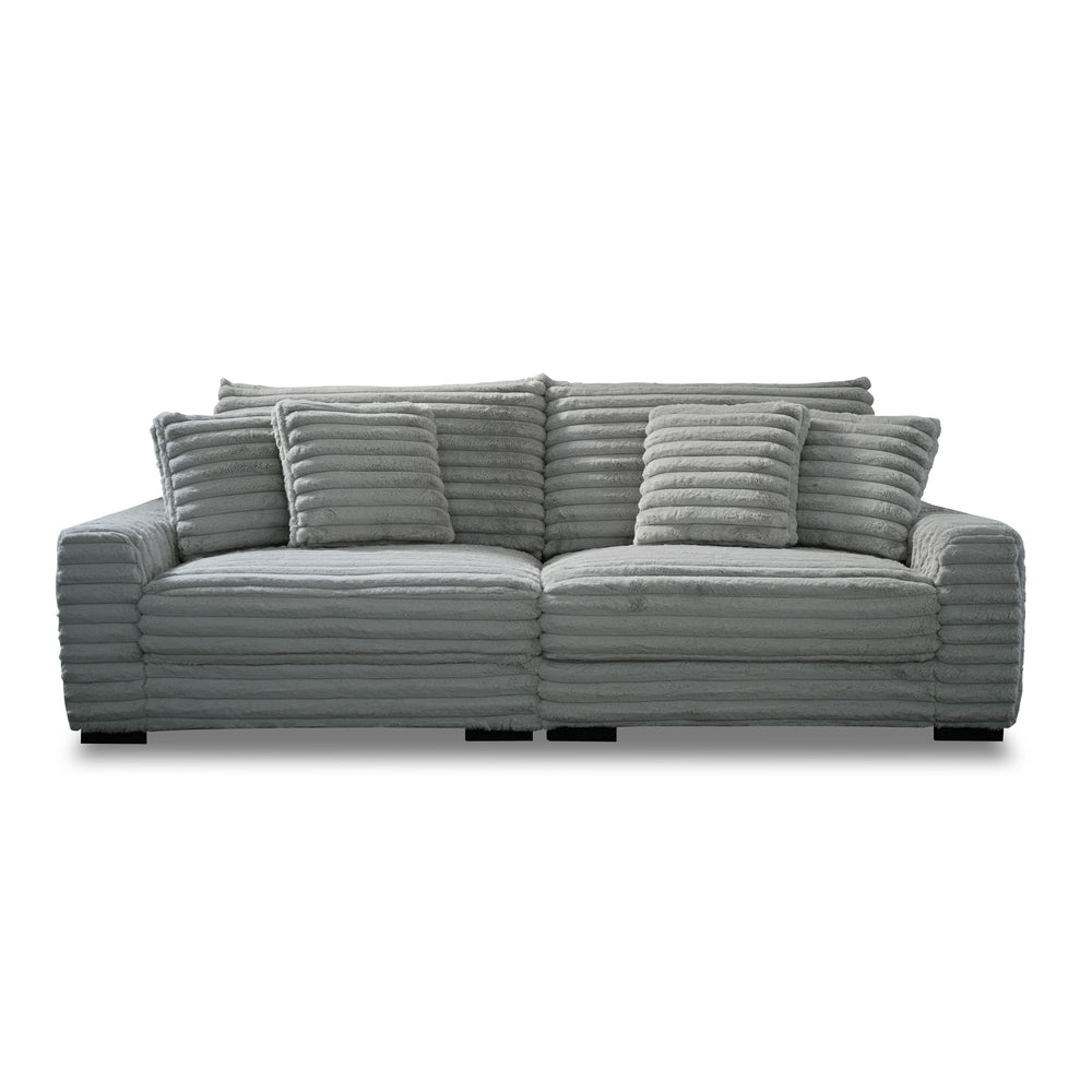 This two-piece Embrace sofa in gray is designed to transform your living space into a haven of comfort and style. Made from 100% polyester fabric with a plush, blanket-like texture, it promises ultimate relaxation. The set includes a right arm facing chai