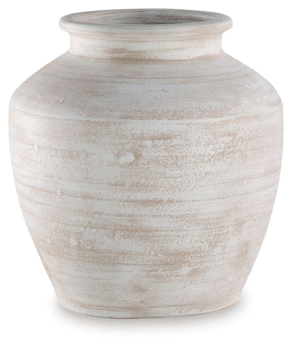 Celebrate the artisanal character of ceramics with this vase. Its distressed white finish has a time-worn, weathered appeal, offering the look of the past with a modern feel. The vase-'s neutral tone makes it a go-to for all seasons, allowing you to stage
