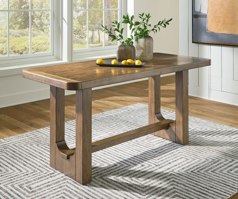 Define your dining space with reliable function and style. This counter height table sits comfortably at the intersection of modern lodge and casual lifestyle aesthetics. Its softly rounded corners keep kids safe and your dining area stylish. Charming arc