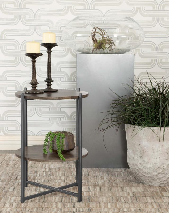 Blending modern simplicity with functional design, this two-tier round accent table is a versatile addition to any space. Crafted from eco-friendly solid mango wood, the natural-finish tabletops bring warmth and organic charm, while the sleek gunmetal-fin