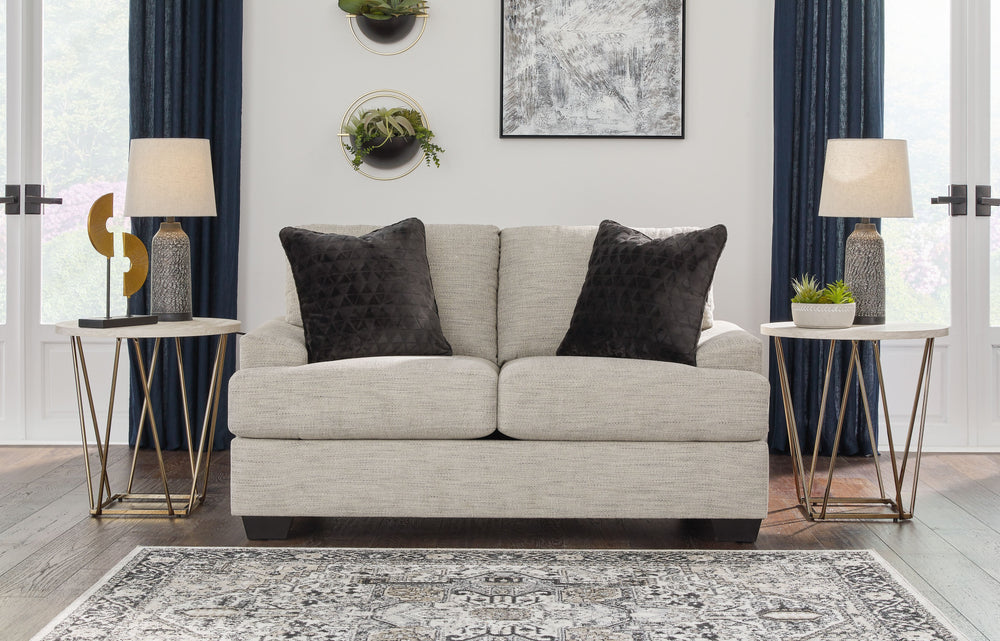 Laid-back luxury meets neutral practicality in this loveseat. Taking its cues from contemporary design, the clean-lined piece is outfitted with angular arms for a layer of geometric expression. Softly upholstered, sizable cushions keep you comfortable, wh