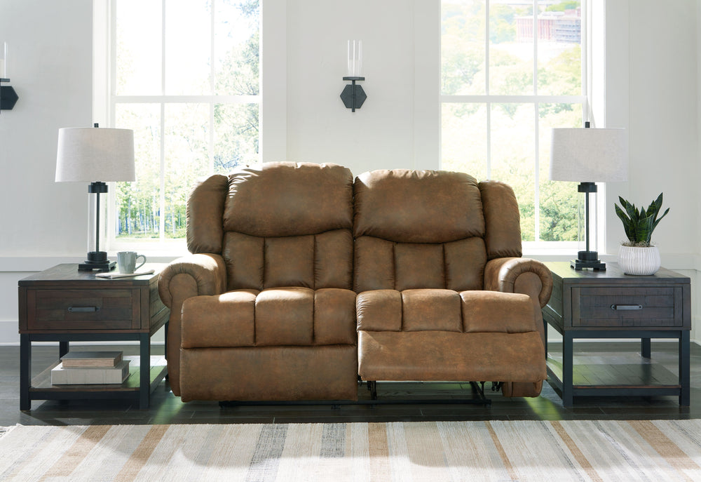 Expansive elegance. This reclining loveseat makes a sizable style statement. Its large scale enhances the luxe appearance, magnifying the beauty of richly warm brown faux leather. Polishing off the piece is an effortless reclining motion, which adds a lay