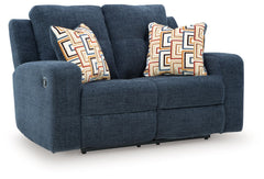 This reclining loveseat invites you to a luxuriously soft lounging experience. The chic hue fits right in with contemporary color palettes. A tufted back keeps the look right on trend. Balancing style and function, its pull tab reclining effortlessly take
