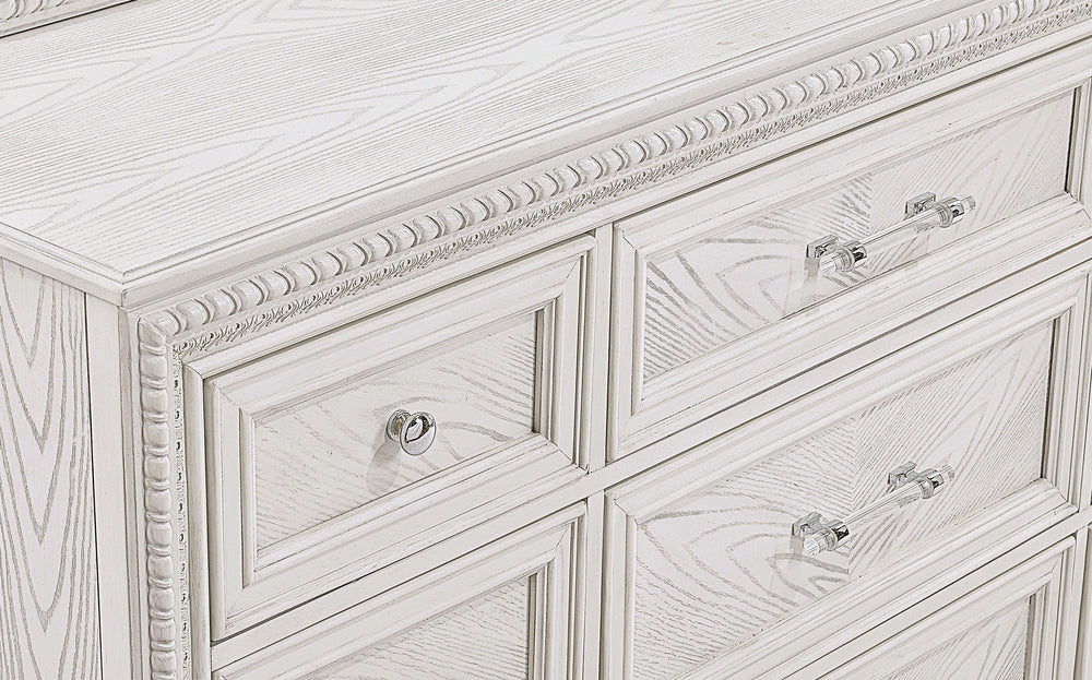 Introducing a bedroom collection that brings a breath of fresh sophistication to any living space. This suite boasts a bright, antique white finish that immediately brightens and opens up a room, providing a versatile foundation for any decor style. The b