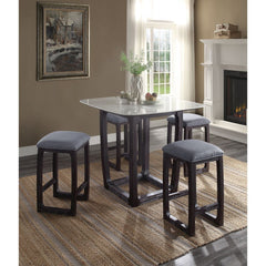 Simple, smart, and stylish, the Razo counter height set is the perfect solution for small spaces. The compact square table has a smooth marble top that stands out in lovely contrast with the weathered espresso finish of the wooden sled base. A subtle deco