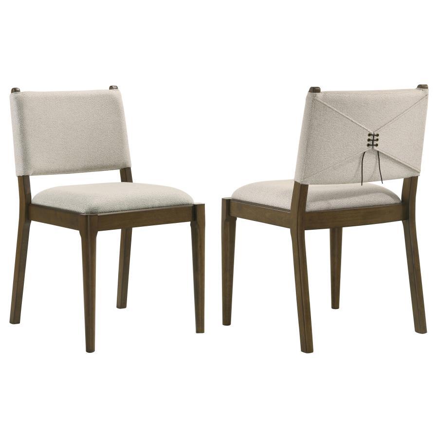 This stylish dining chair merges modern design with elegant craftsmanship. Featuring a wrapped backrest accented by unique brown tie detailing on the back, it adds a sophisticated touch to your dining space. Upholstered in soft light tan fabric, the chair