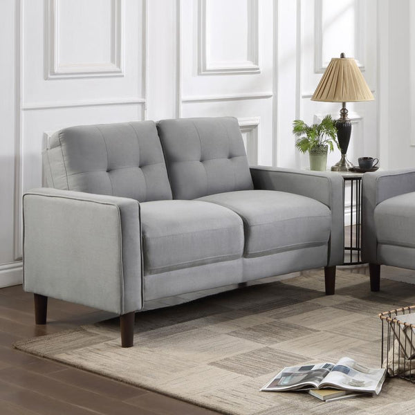  this loveseat boasts a perfect small-scale design. Its classic track arm and self-welt detailing highlight the superior tailoring. The grid-tufted boxed back cushions and pocket coil spring cushion construction 