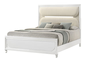  accented with sleek mirrored trim that adds a touch of shine and refinement. The centerpiece is an opulent bed with an oversized he