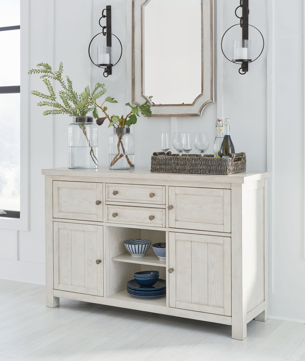 This dining server is sure to impress come mealtime. With its antiqued white finish and planked effect cabinet doors, farmhouse-style storage has never been so fashionable. All thatâ€™s missing is you and your family.<br><br><b>Additional Dimensions</b><b