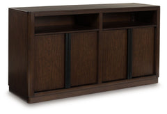 Casual contemporary styling with a decidedly modern vibe. This dining server dresses your dining spot in on-trend elegance with its rich warm brown finish. Full-length metal pulls in a matte black tone add a subtly cool touch to spacious storage cabinets.