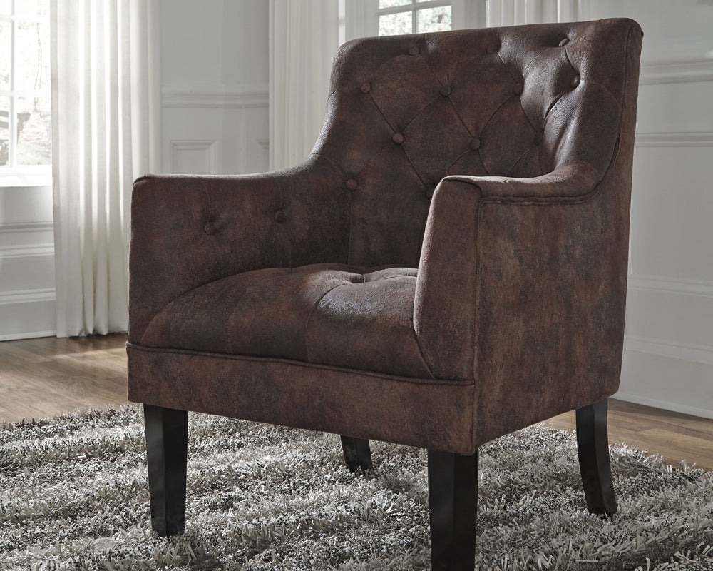 This accent chair with fashion-forward high leg silhouette gives a new meaning to traditional. Diamond button tufting garnishes the back and the plump seat. Distressed fabric with the look of quality leather adds a classic touch that you can appreciate. M