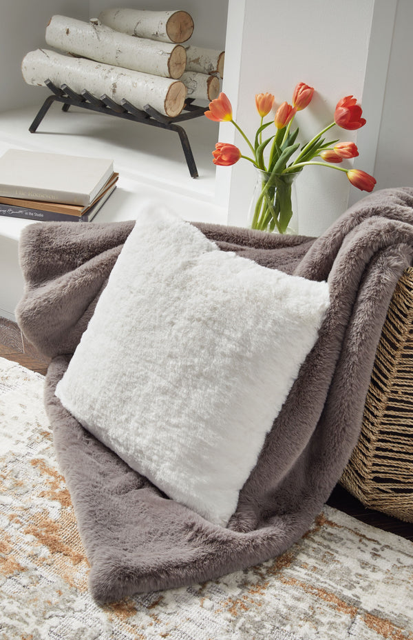  subtle and sensational. The plush feel of this faux rabbit fur pillow will drive you wild. Its white hue pairs with a variety of decor