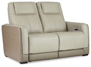 Double down on sleek style with this power reclining loveseat. It has a streamlined, space-conscious appeal, with two-tone upholstery in neutral hues creating subtly striking visual intrigue. And with one-touch reclining, adjustable headrests and wireless