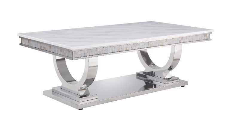 This beautiful contemporary work places a strong emphasis on lustrous materials that make a bold statement of personality and style. Shiny metal frame and white marble top complement each other perfectly, making the table more visually appealing. The Zand